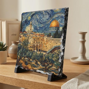 May include: A decorative stone print of Jerusalem in the style of Van Gogh's "Starry Night." The artwork features a golden-domed building, olive trees, and a swirling blue night sky. The stone is displayed on a black stand.