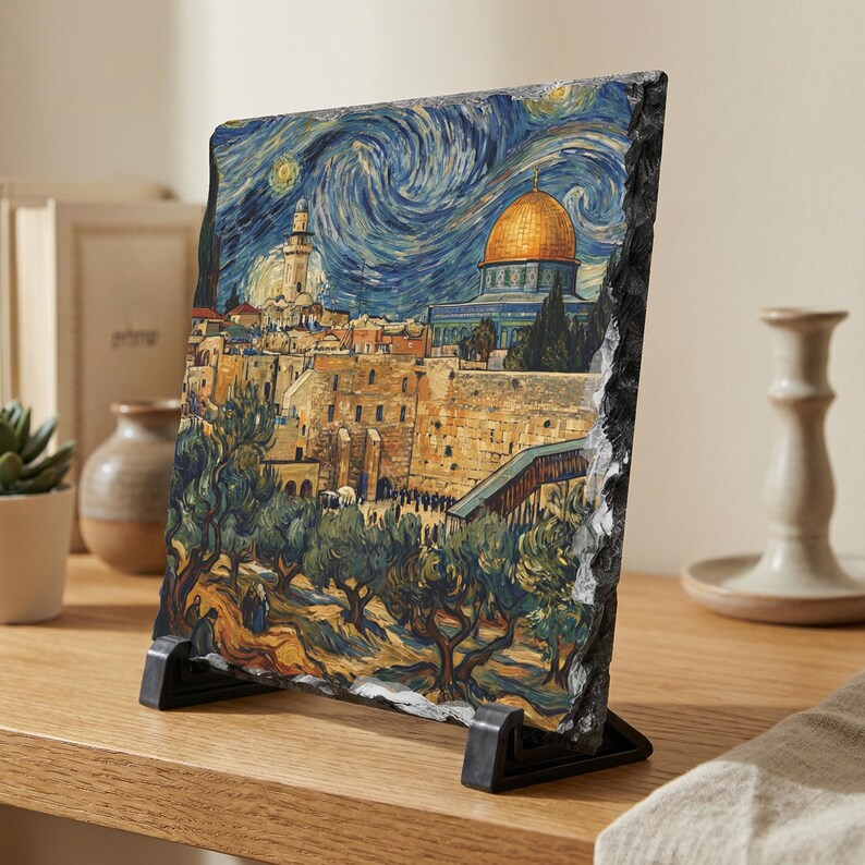 May include: A decorative stone print of Jerusalem in the style of Van Gogh's "Starry Night." The artwork features a golden-domed building, olive trees, and a swirling blue night sky. The stone is displayed on a black stand.