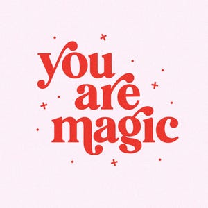 May include: A pink background with the words "You are magic" in a bold, red, decorative font. Small red dots and plus signs are scattered around the text. The overall design is simple and uplifting.