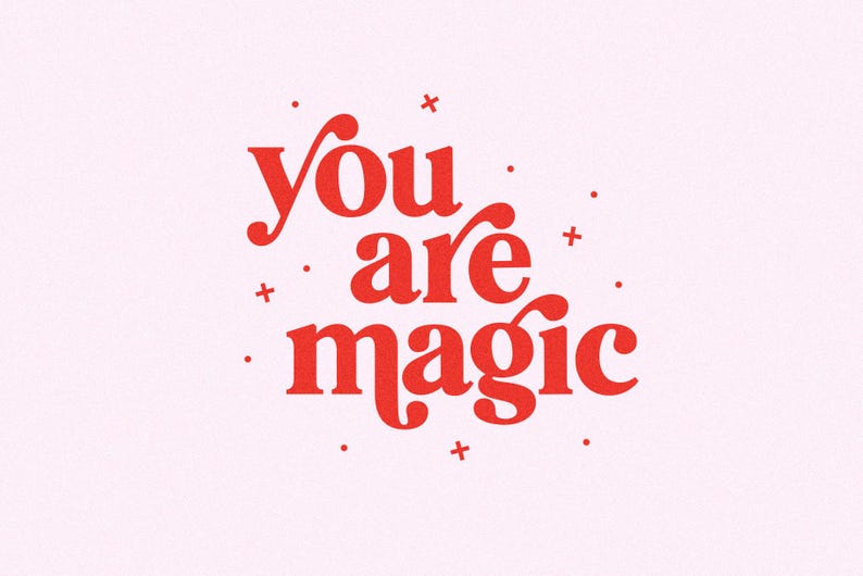 May include: A pink background with the words "You are magic" in a bold, red, decorative font. Small red dots and plus signs are scattered around the text. The overall design is simple and uplifting.