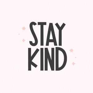 May include: Black and white text on a light pink background that reads "STAY KIND" with small pink flower accents.
