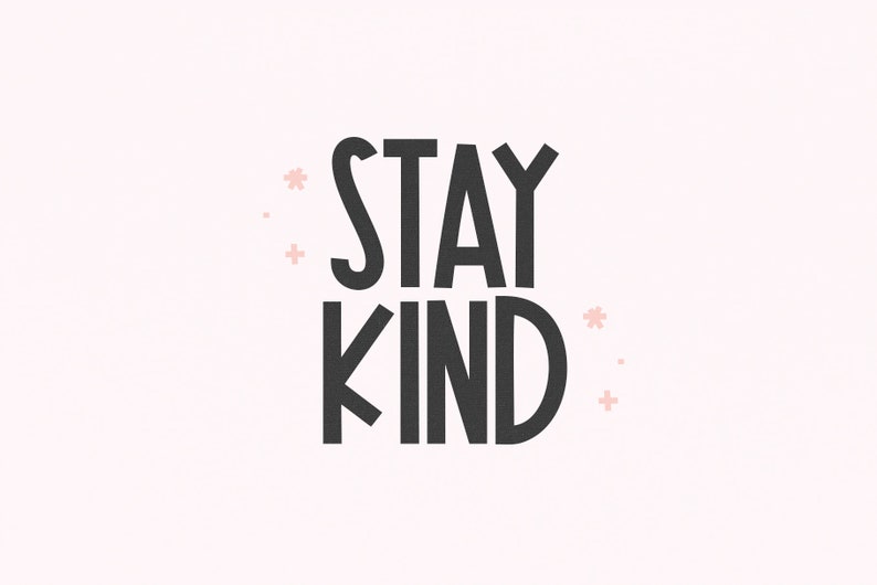 May include: Black and white text on a light pink background that reads "STAY KIND" with small pink flower accents.