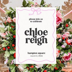 May include: A floral wreath surrounds a white invitation with pink trim. The invitation reads "please join us to celebrate Chloe Reign" and includes the location and date. Pink bows and door frame are visible.
