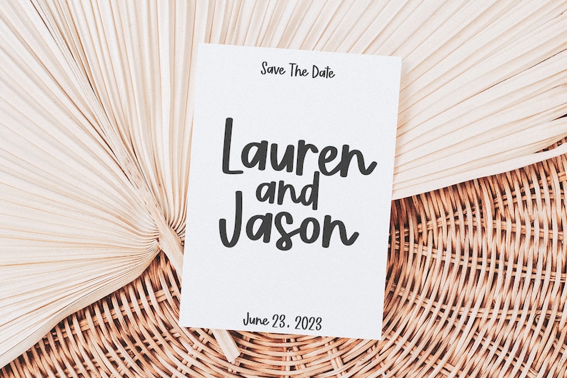 May include: Save the date card with a white background and black text. The text reads "Save The Date", "Lauren and Jason", and "June 23, 2023".