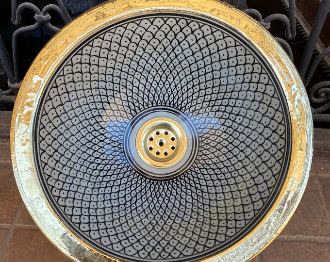 Sink. Drop-in/under-mount brass rim sink, ceramic countertop or built-in sink with brass rim.