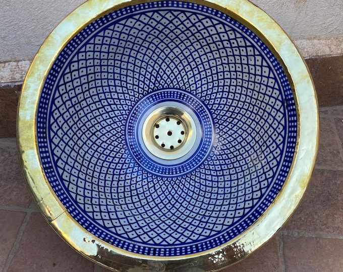 Sink. Drop-in/under-mount brass rim sink, ceramic countertop or built-in sink with brass rim.