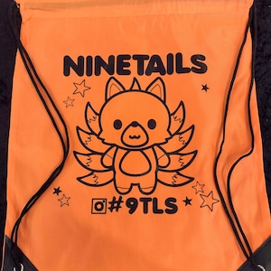 May include: Orange drawstring bag with black print of a cartoon nine-tailed fox with the text "NINETAILS" and "#9TLS".