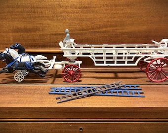 Vntage Cast Iron Fire Hook Ladder Wagon Trio Horses Detachable Ladders.