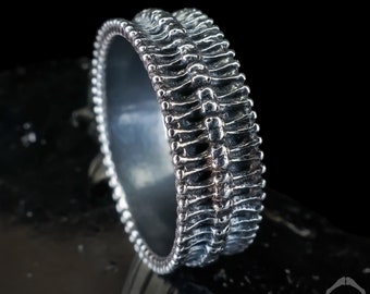 Gothic silver spine ring, bones repeat in this dark HR Giger inspired biomechanical design
