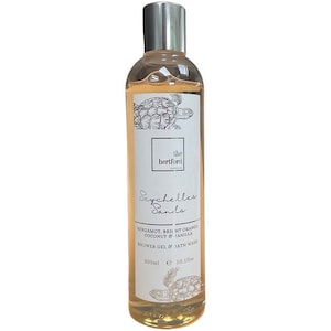May include: A clear plastic bottle of Seychelles Sanils shower gel and bath wash. The bottle is labeled with the text "the hertford" and "Seychelles Sanils". The ingredients are listed as "bergamot, bright orange, coconut & vanilla". The bottle is 300 ml or 10.1 fl oz.
