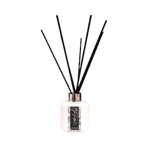 May include: White ceramic diffuser bottle with black reeds and a silver cap. The bottle has a black and white label with the text "City Hotel" written in cursive.