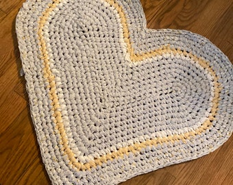 Heart shape, rag rug, handmade, crocheted with recycled, cotton linens. Durable, reversible, washable and unique. 28 x 26 yellow gray white.