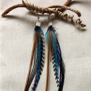 Hanging earrings made of natural feathers