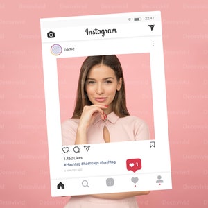 May include: A woman with long brown hair is posing for a photo in a pink shirt. The photo is displayed in an Instagram frame with the caption "1,452 Likes #Hashtag #hashtags #hashtag 6 MINUTES AGO".