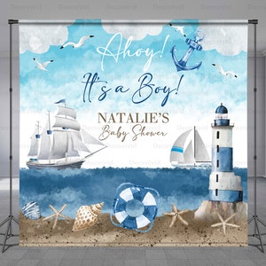May include: A blue and white nautical themed backdrop for a baby shower. The backdrop features a sailboat, a lighthouse, a life preserver, seashells, and starfish. The text "Ahoy! It's a Boy! Natalie's Baby Shower" is written on the backdrop.