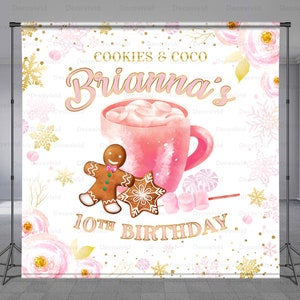 May include: A backdrop for a 10th birthday party, featuring a pink mug of hot cocoa with marshmallows, gingerbread cookies, and the name "Brianna's" in pink script. The words "Cookies & Coco" and "10th Birthday" are also displayed.