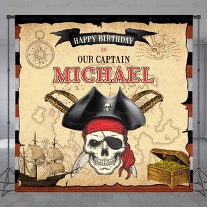 May include: A pirate-themed birthday party backdrop with a treasure map, a skull and crossbones, and the text "Happy Birthday to Our Captain Michael".