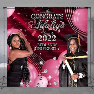May include: A graduation backdrop with a red background and pink balloons. The text "CONGRATS Adaliya Class of 2022 REDLANDS UNIVERSITY" is printed in silver on the backdrop.