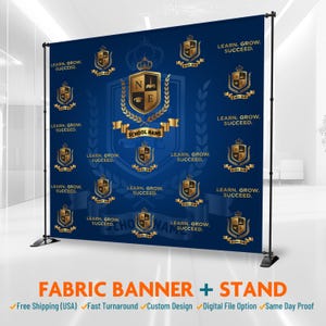 May include: A navy blue fabric banner with a gold and white school crest design, mounted on a black stand. The banner features the text "LEARN. GROW. SUCCEED." and "SCHOOL NAME."