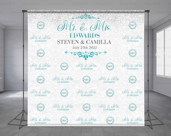 May include: A white backdrop with a silver glitter overlay and a repeating pattern of teal blue circles with the text "Mr. & Mrs. EDWARDS" and "S&C". The text "Mr. & Mrs. EDWARDS STEVEN & CAMILLA July 25th 2022" is written in a decorative script font.