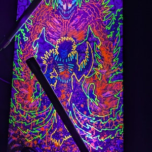 May include: A black and purple canvas painting with a neon green and orange design. The painting features a creature with sharp teeth and claws, surrounded by a swirling pattern.