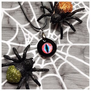 Evil Eye Halloween Black Pink and Blue Round Resin Pendant Necklace