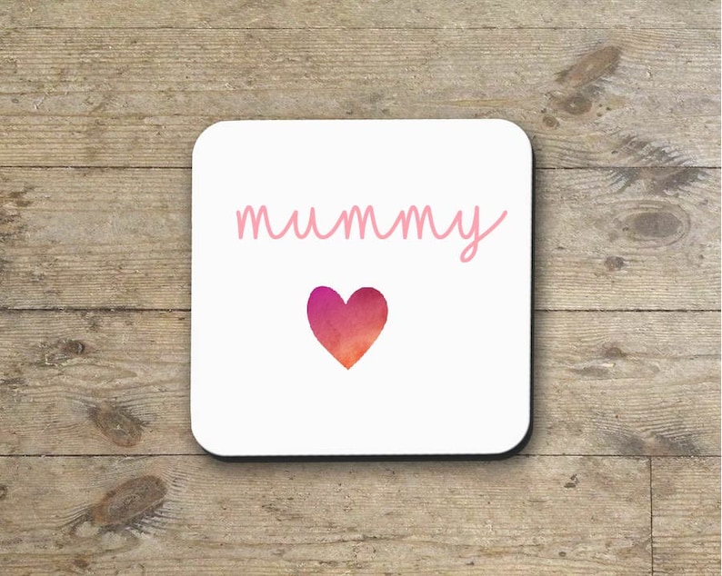 May include: White coaster with the word "mummy" written in pink cursive script and a pink and orange watercolor heart.