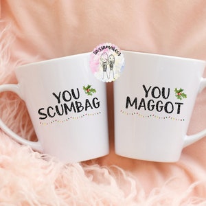 Juego de tazas a juego con la frase "¡Eres un canalla, un gusano!" / Tazas navideñas divertidas / Tazas a juego para él y para ella / Para marido y mujer / Taza "Cuento de hadas de Nueva York" imagen 1