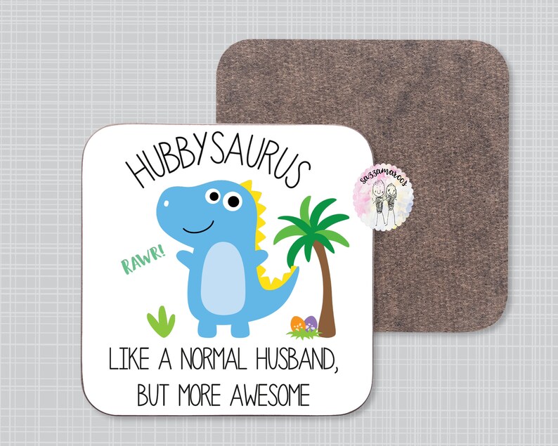 May include: White coaster with a blue dinosaur cartoon illustration and the text "Hubbysaurus, Rawr! Like a normal husband, but more awesome".
