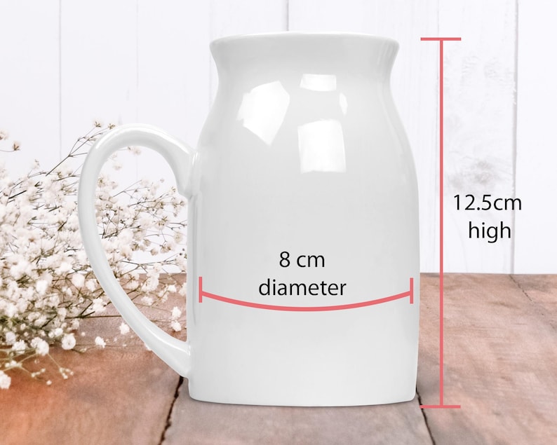 May include: White ceramic mug with a handle, 8 inches in diameter and 12.5 inches high.