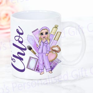 May include: White ceramic mug with a purple and pink design featuring a cartoon girl in pyjamas with makeup and the name "Chloe" in purple text.