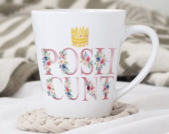 May include: White ceramic mug with a gold crown and pink floral design. The mug says "POSH CUNT" in pink letters.