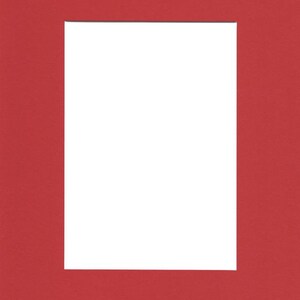 May include: A red mat with a white rectangular opening in the center. The mat is designed to be used as a frame for a picture or artwork.