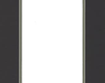 May include: A black picture mat with a white opening and a thin, light green border. The mat is rectangular and designed for displaying photographs or artwork. The mat's dimensions are not visible.