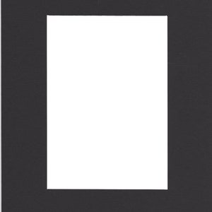May include: A black mat with a white rectangle in the center. The mat is designed to be used as a frame for a picture or artwork.
