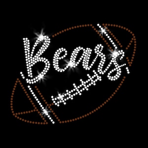 May include: A black graphic featuring the word "Bears" spelled out in white rhinestones, set against a brown football shape. The design has a sparkling effect, with highlights around the letters and the football outline.