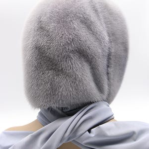 Folded view sapphire mink hood - compact fur head scarf presentation, handcrafted hood wrap showing portability and luxury finish