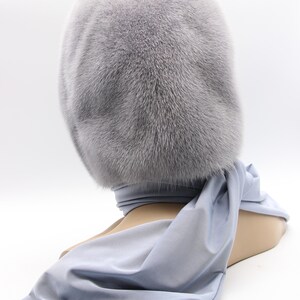 Draped presentation sapphire fur hood - elegant folded display of handmade mink scarf, showing versatility as head or neck wear