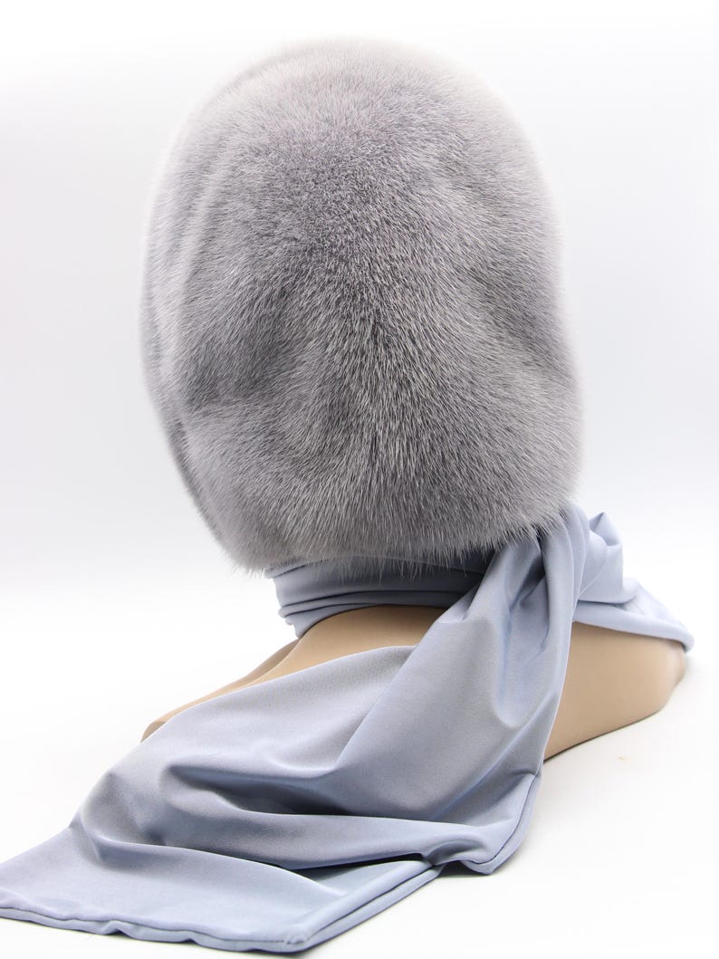 Draped presentation sapphire fur hood - elegant folded display of handmade mink scarf, showing versatility as head or neck wear