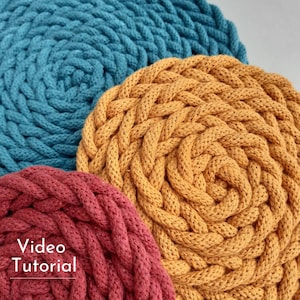 May include: Three round woven macrame coasters in teal, orange, and burgundy.