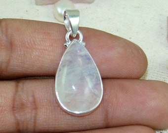 May include: A teardrop-shaped pendant with a white moonstone gemstone set in sterling silver.