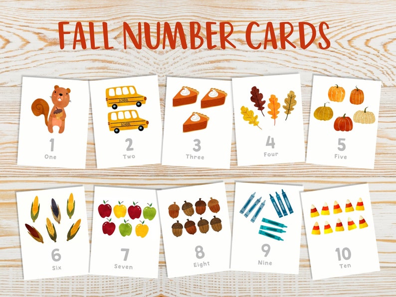 May include: Ten printable cards featuring fall-themed illustrations and numbers 1 through 10. Each card has a different image, such as a squirrel, school bus, pumpkin, and corn. The cards are white with black text and are designed for educational purposes.