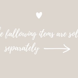 May include: White text on a light grey background reads "The following items are sold separately" with an arrow pointing to the right. A small white heart is at the top of the image.