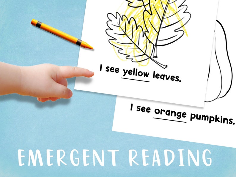 May include: A black and white illustration of a leaf and a pumpkin. The text "I see yellow leaves." and "I see orange pumpkins." is written below the illustrations. The word "EMERGENT READING" is written at the bottom of the page.