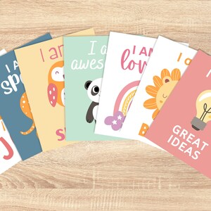 May include: Set of eight colourful affirmation cards with illustrations of a sun, a cat, an owl, a panda, a rainbow, a lion, a light bulb, and text that reads "Choose Joy", "I am Special", "I am Awesome", "I am Loved", "I am Brave", "I Have Great Ideas".