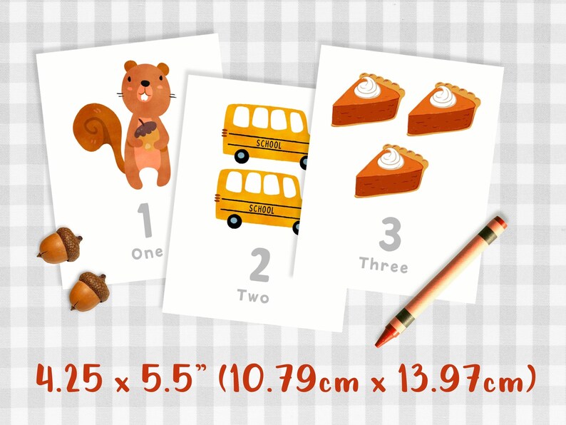 May include: Three printable flashcards featuring a squirrel, school buses, and pumpkin pies. Each card has a number, the number word, and a corresponding image. The cards measure 4.25 inches by 5.5 inches.