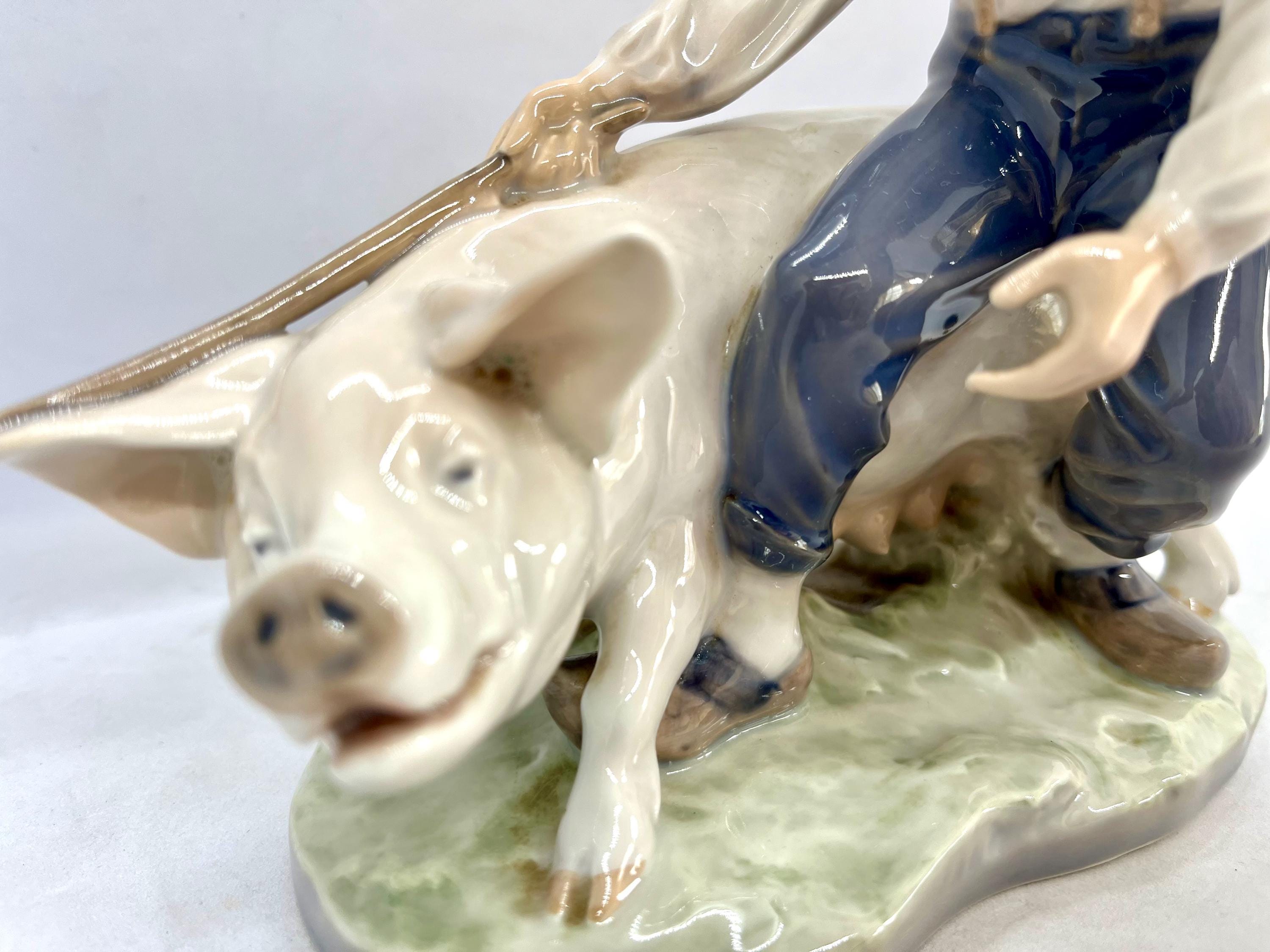 Royal Copenhagen Figurine, Farmer Boy With a Pig, Large Figurine