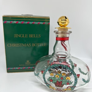 Holmegaard Christmas Aquavit bottle with Brass bell stopper, "Jingle bells" this bottle is called, including original box, Denmark 1989