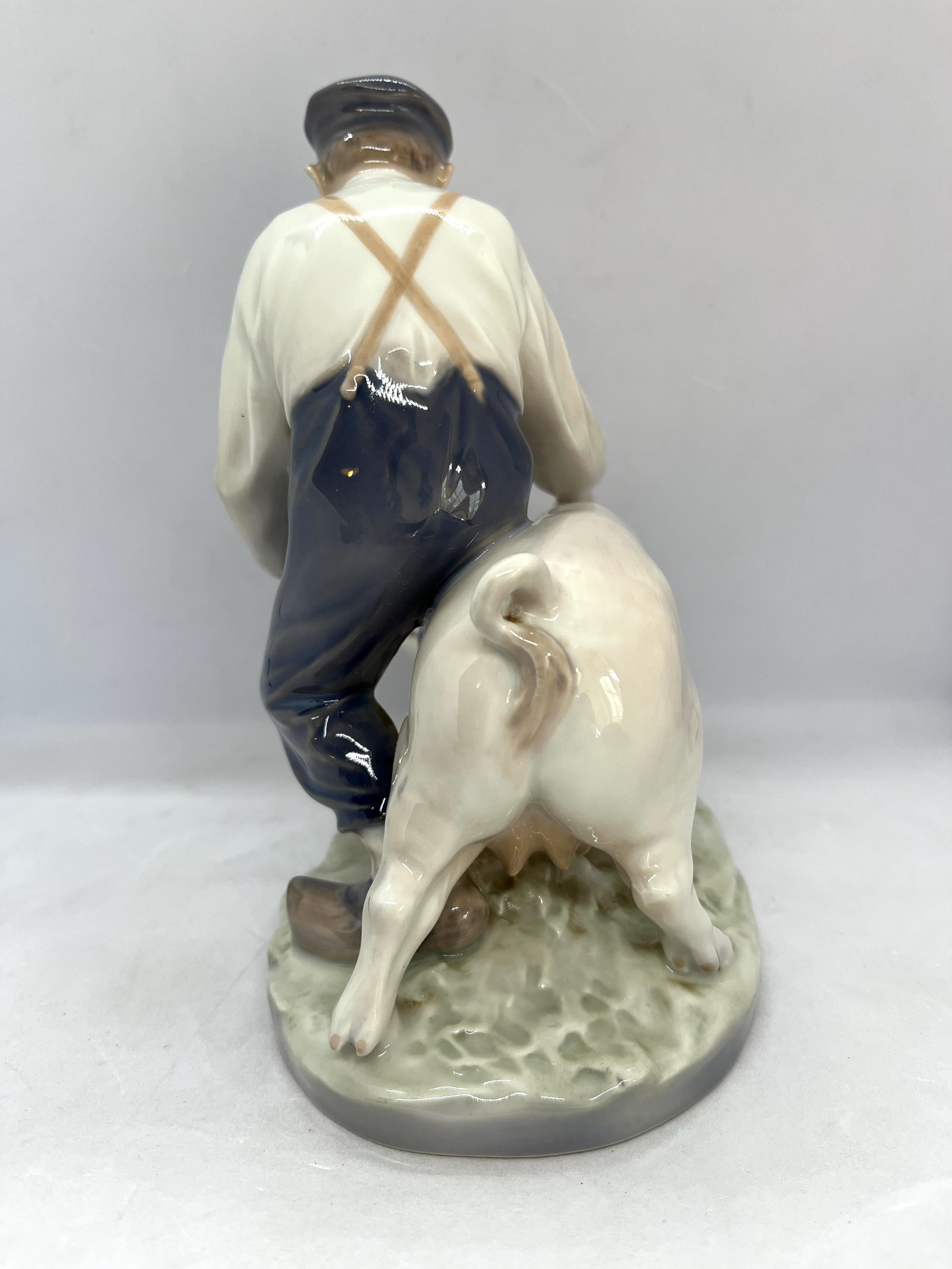 Royal Copenhagen Figurine, Farmer Boy With a Pig, Large Figurine