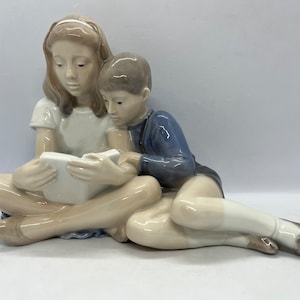 Royal Copenhagen figurine, large antique extremely rare Boy and Girl reading figurine number 4670, rare 1950s danish porcelain design